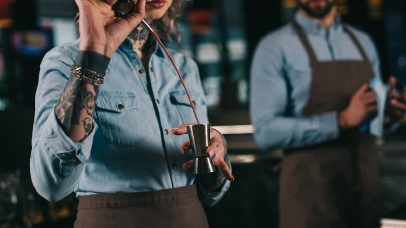 cropped-image-of-bartender-preparing-drink-at-bar-2023-11-27-05-10-56-utc-min